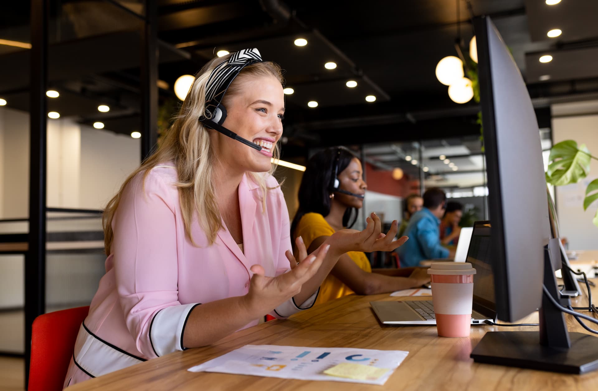 A travel customer support agent happily assisting a customer