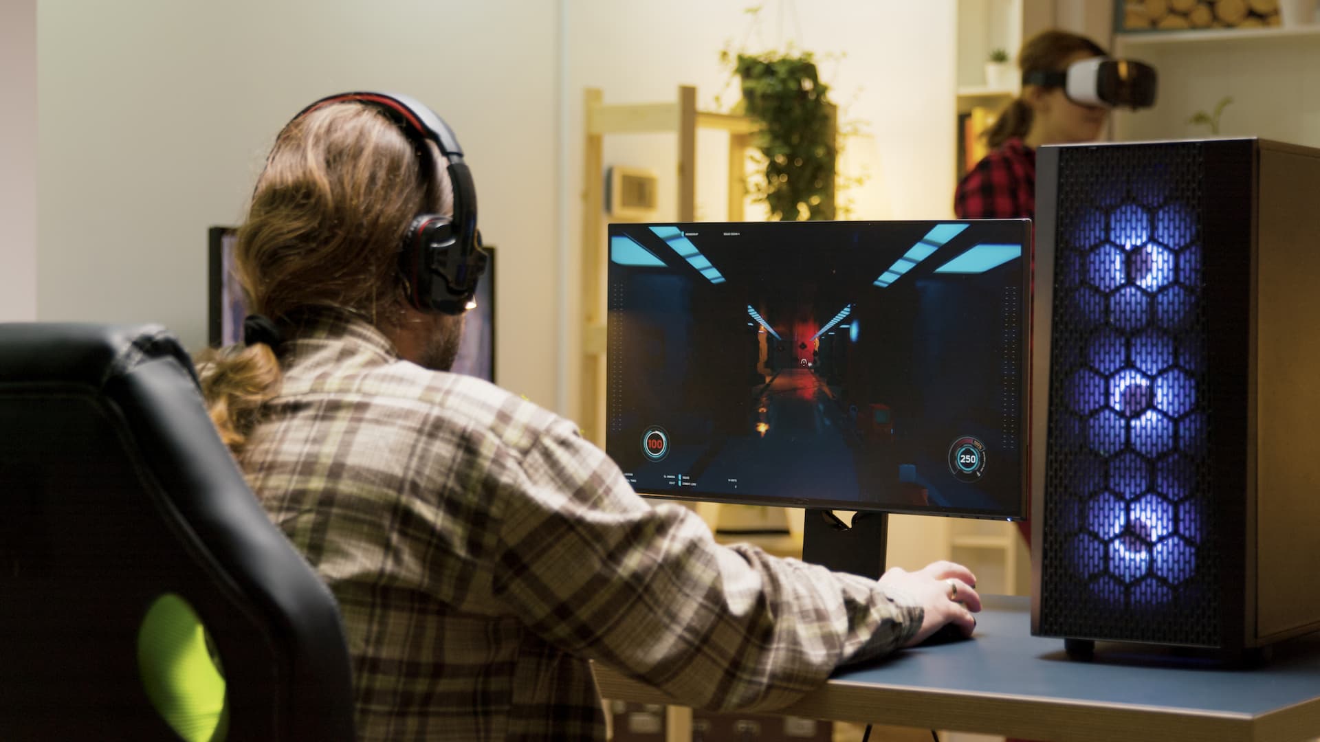 Man keeping his head on desk after losing at video games on computer
