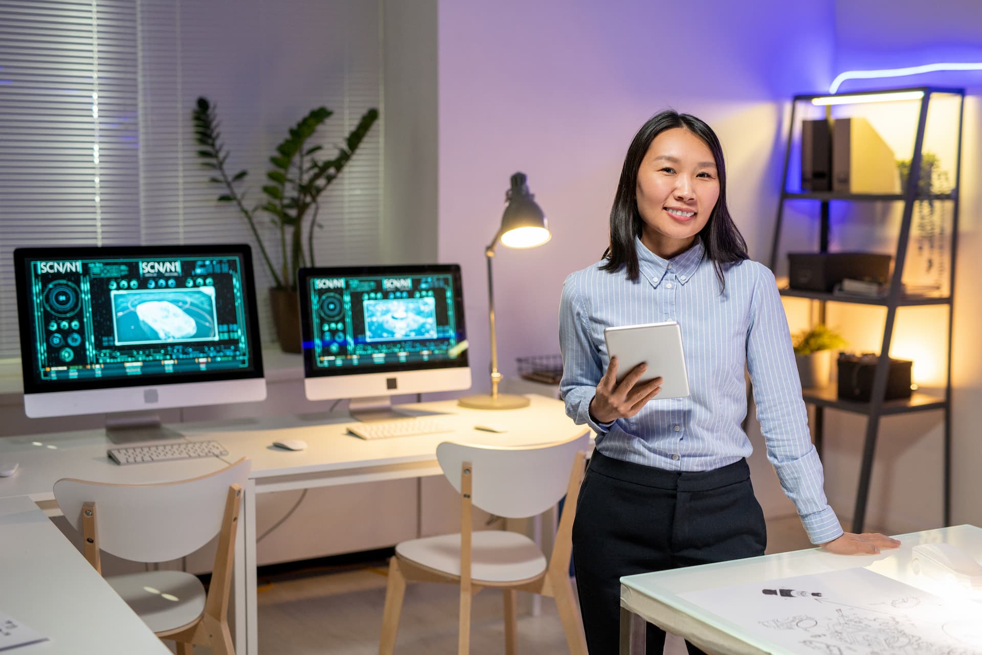 Portrait of attractive Asian car designer in office